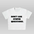 Don’t ask questions baby tee - white